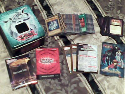 Yugioh lot of 156 cards, a collectable tin, and more-image